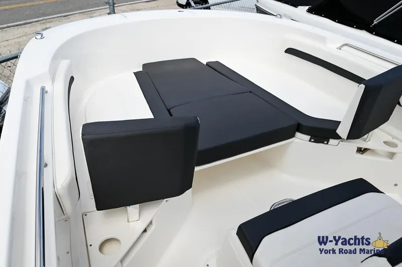 Slide: The Image of 2023 Bayliner T24 boat interior with black and white seating. - 5