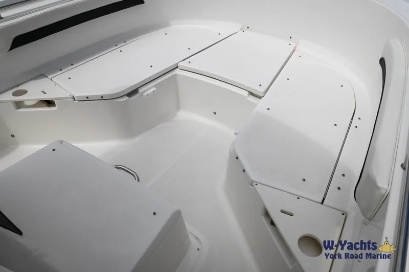 Slide: The Image of 2023 Bayliner T24 boat interior seating area, white upholstery, spacious design. - 8