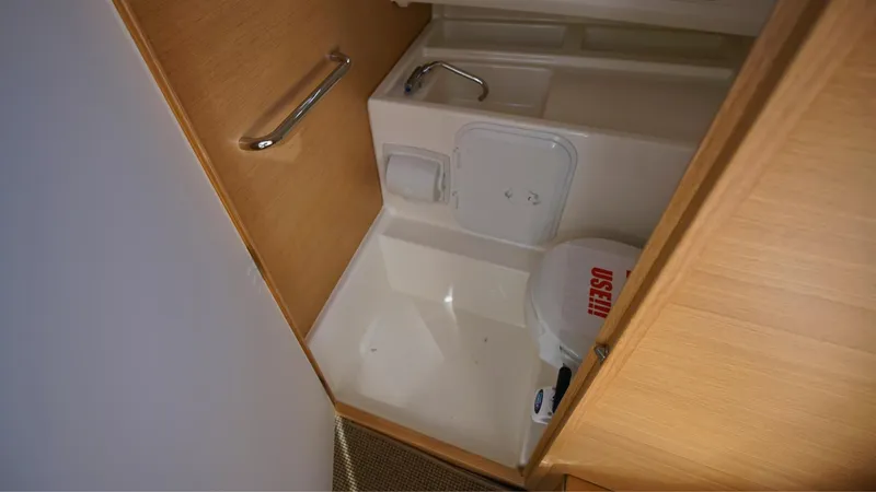 Slide: The Image of Compact bathroom in 2024 Nimbus Tender 8 #281 boat, featuring sink and toilet. - 16