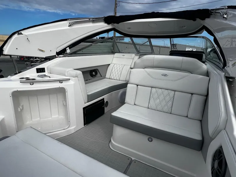 Slide: The Image of 2024 Regal 28 Express boat interior with luxurious seating and modern design. - 10