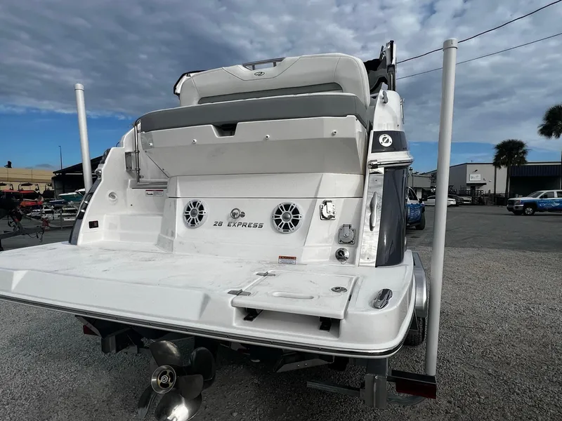 Slide: The Image of 2024 Regal 28 Express boat rear view with swim platform and speakers. - 3