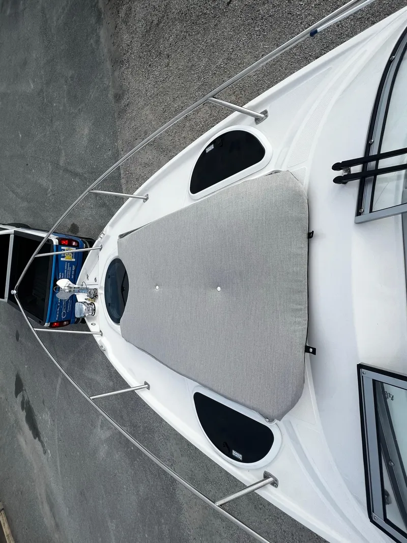 Slide: The Image of 2024 Regal 28 Express boat with sunpad on deck. - 6