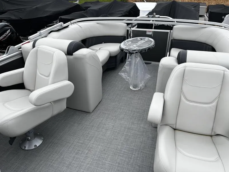 Slide: The Image of 2024 Sylvan Mirage 8522 LZ pontoon boat with luxurious seating and table. - 3