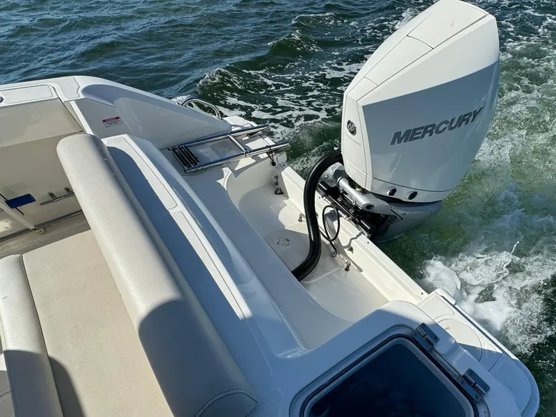 Slide: The Image of 2022 Boston Whaler 230 Outrage boat with Mercury outboard engine on water. - 10