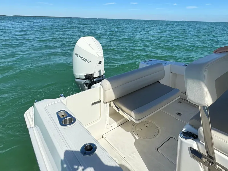 Slide: The Image of 2022 Boston Whaler 230 Outrage boat with Mercury engine on open water. - 11