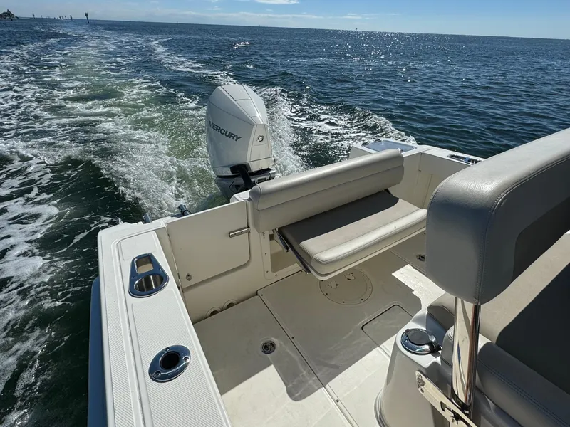 Slide: The Image of 2022 Boston Whaler 230 Outrage boat cruising on open water. - 12