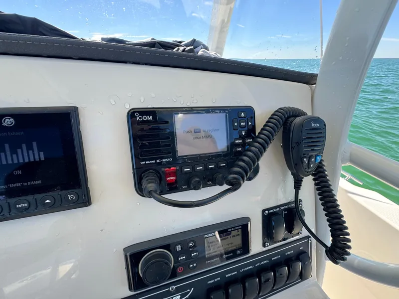 Slide: The Image of Control panel of a 2022 Boston Whaler 230 Outrage boat with Icom radio. - 21