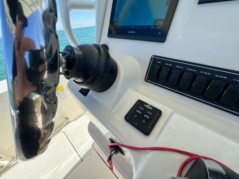 Slide: The Image of Control panel of a 2022 Boston Whaler 230 Outrage boat with navigation screen. - 22