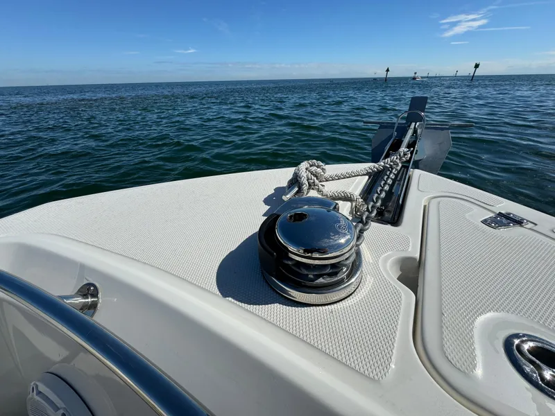 Slide: The Image of Boston Whaler 230 Outrage 2022 boat bow with anchor and winch on open water. - 28