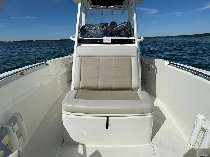 Slide: The Image of 2022 Boston Whaler 230 Outrage boat interior with cushioned seating. - 30