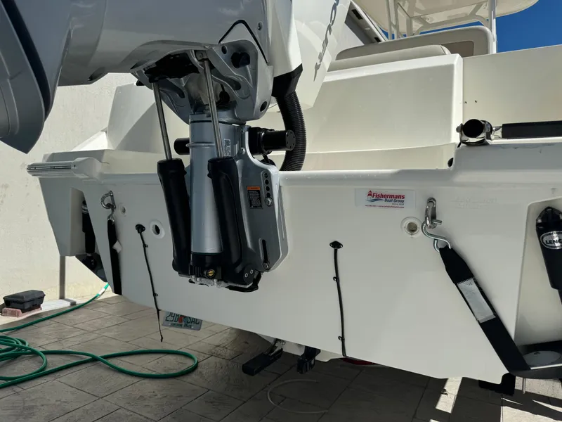 Slide: The Image of 2022 Boston Whaler 230 Outrage boat stern with outboard motor. - 39