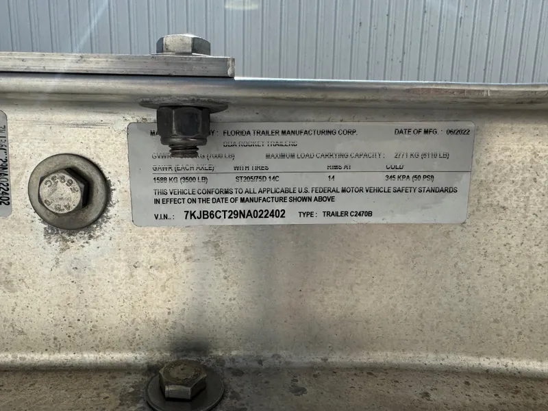Slide: The Image of 2022 Boston Whaler 230 Outrage trailer identification plate with VIN and manufacturing details. - 40