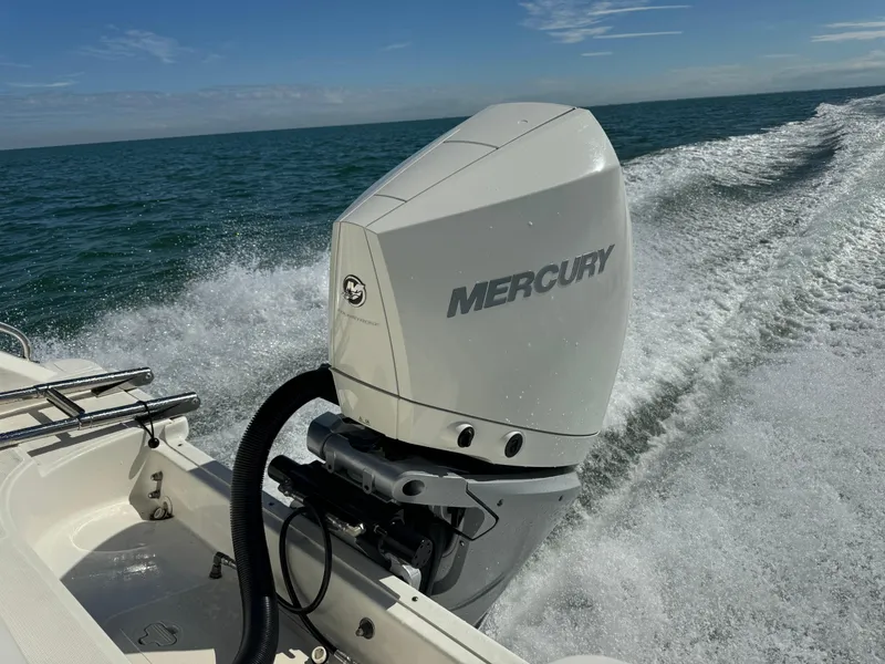 Slide: The Image of Boston Whaler 230 Outrage 2022 with Mercury outboard motor on open water. - 6