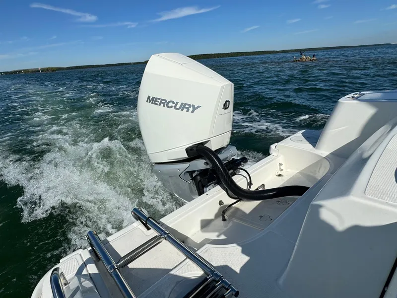 Slide: The Image of Boston Whaler 230 Outrage 2022 with Mercury outboard motor on open water. - 8