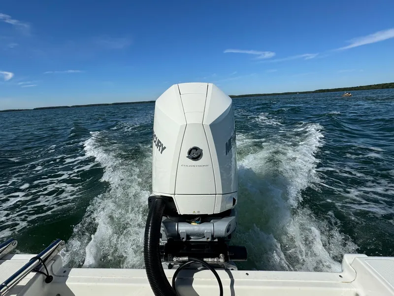 Slide: The Image of Boston Whaler 230 Outrage 2022 boat with Mercury engine on open water. - 9