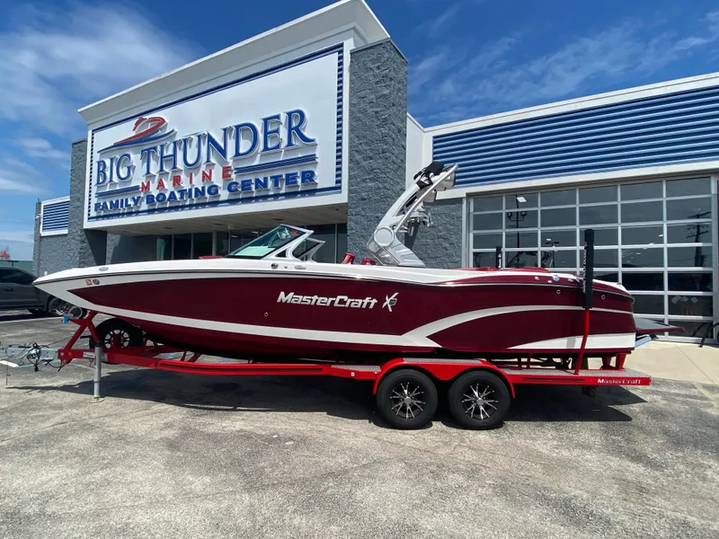 Slide: The Image of 2017 MasterCraft X26 boat on trailer at Big Thunder Marine dealership. - 0
