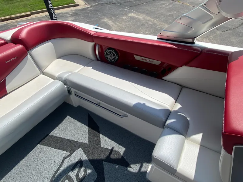 Slide: The Image of Interior of 2017 MasterCraft X26 boat with red and white seating. - 12