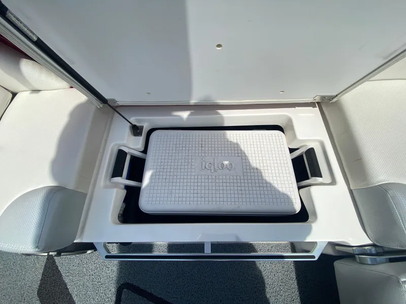 Slide: The Image of 2017 MasterCraft X26 boat storage compartment with Igloo cooler inside. - 21
