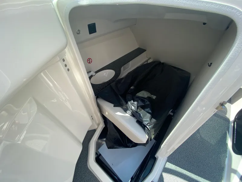 Slide: The Image of 2017 MasterCraft X26 boat interior storage compartment with sink and counter. - 24