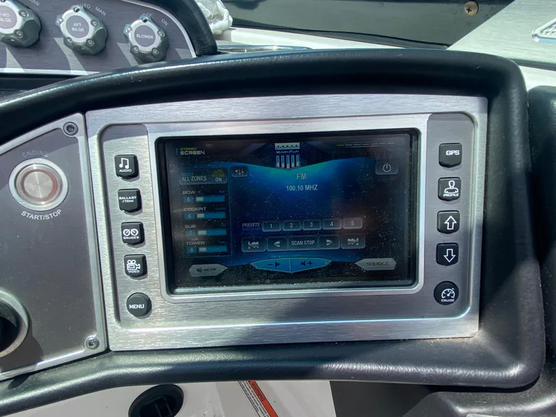 Slide: The Image of 2017 MasterCraft X26 dashboard with touchscreen display and control buttons. - 33
