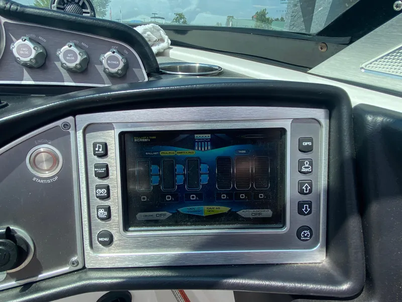Slide: The Image of 2017 MasterCraft X26 dashboard with touchscreen controls and navigation system. - 34