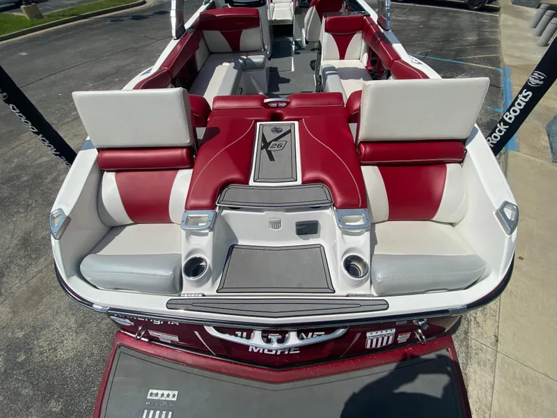 Slide: The Image of 2017 MasterCraft X26 boat interior with red and white seating, showcasing luxury design. - 9