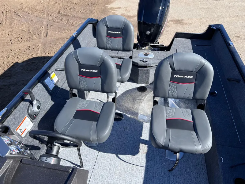 Slide: The Image of 2024 Tracker Pro Guide V-16 SC boat interior with three seats. - 11