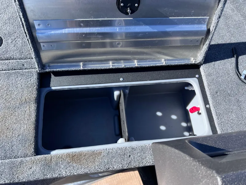Slide: The Image of 2024 Tracker Pro Guide V-16 SC storage compartment with open lid. - 14