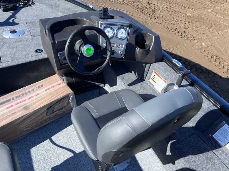 Slide: The Image of 2024 Tracker Pro Guide V-16 SC boat interior with steering wheel and dashboard. - 7