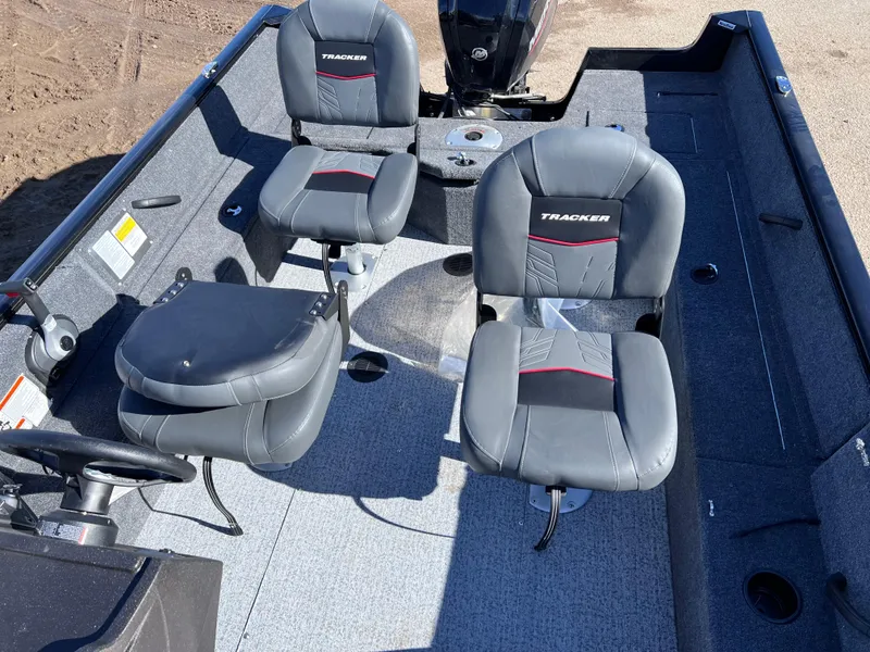 Slide: The Image of 2024 Tracker Pro Guide V-16 SC boat interior with seating and steering wheel. - 9