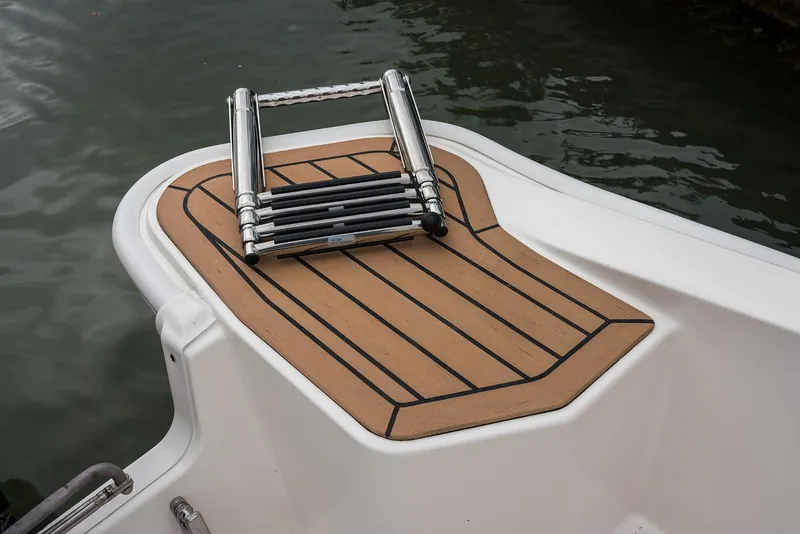 Slide: The Image of 2024 Boston Whaler 160 Super Sport swim platform with ladder. - 25