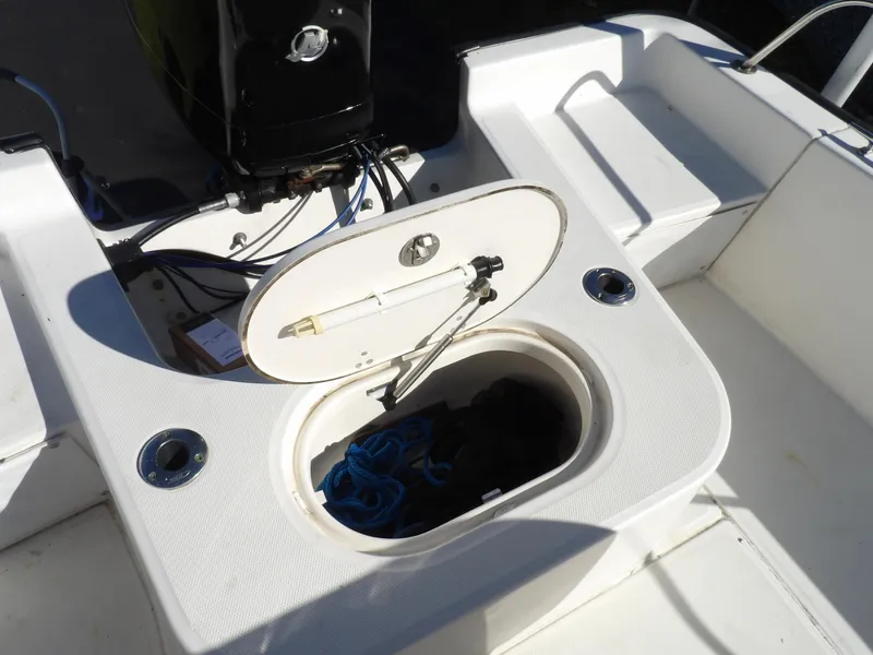 Slide: The Image of 2008 Boston Whaler 190 Nantucket boat storage compartment with open hatch. - 10