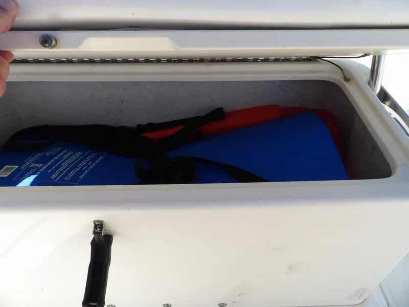 Slide: The Image of Storage compartment of a 2008 Boston Whaler 190 Nantucket boat. - 12