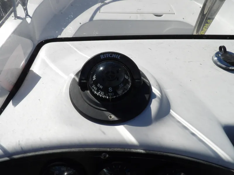 Slide: The Image of Compass on the dashboard of a 2008 Boston Whaler 190 Nantucket boat. - 14