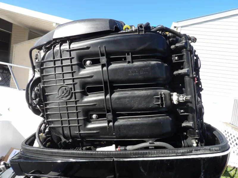 Slide: The Image of Close-up of the engine of a 2008 Boston Whaler 190 Nantucket boat. - 20