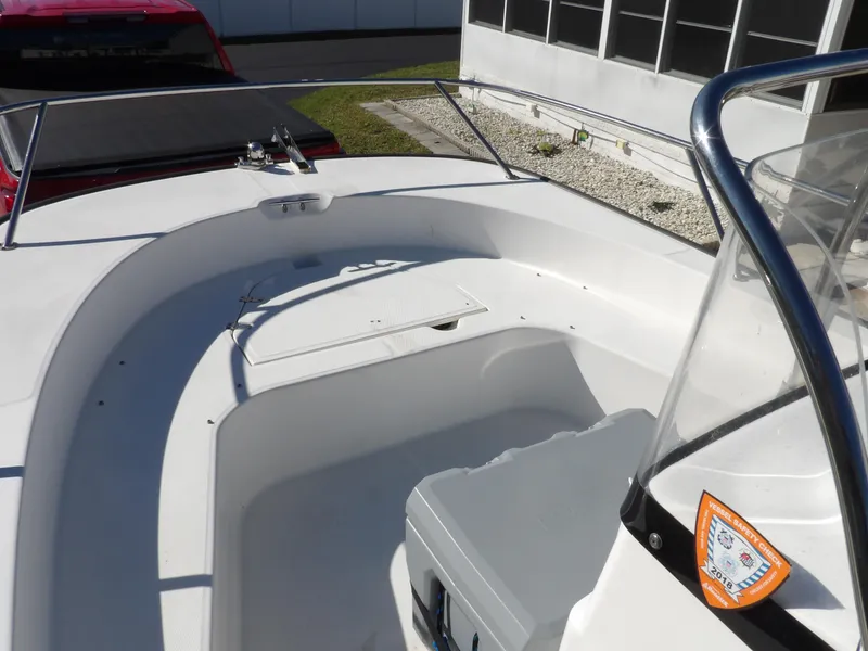 Slide: The Image of 2008 Boston Whaler 190 Nantucket boat interior with seating and storage. - 5