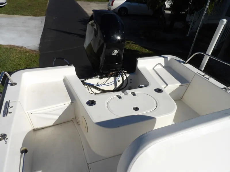 Slide: The Image of 2008 Boston Whaler 190 Nantucket boat stern with outboard motor. - 9