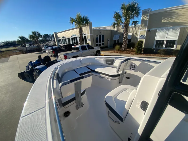 Slide: The Image of 2024 Robalo R200 Center Console boat at a dealership. - 11