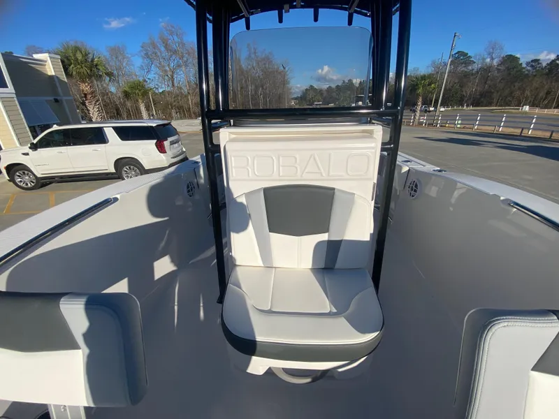 Slide: The Image of 2024 Robalo R200 Center Console boat interior with seating and console. - 14