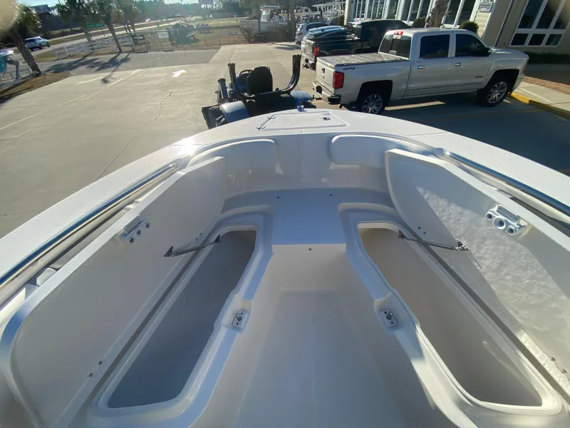 Slide: The Image of 2024 Robalo R200 Center Console boat bow storage compartments. - 17