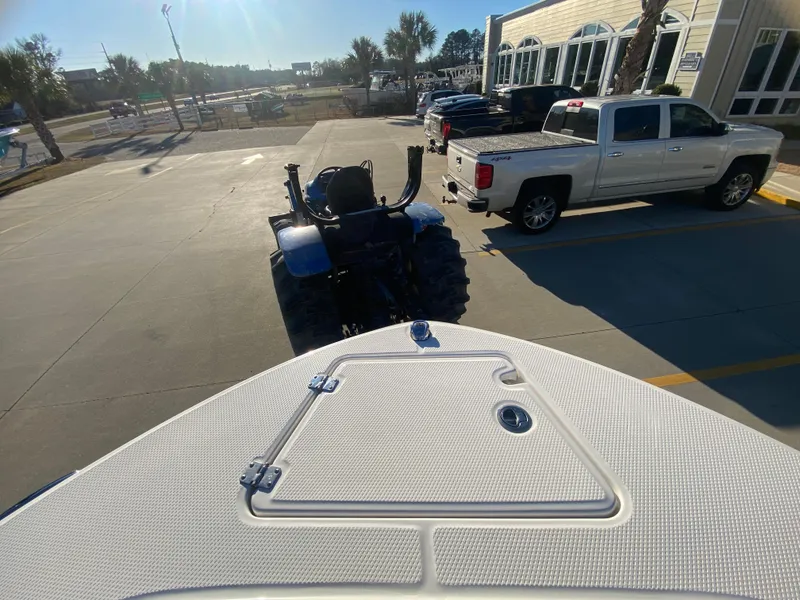 Slide: The Image of 2024 Robalo R200 Center Console boat on trailer in parking lot. - 19