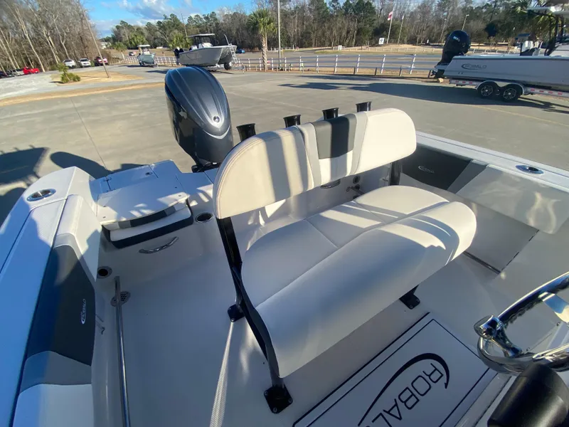 Slide: The Image of 2024 Robalo R200 Center Console boat interior with seating and outboard motor. - 7