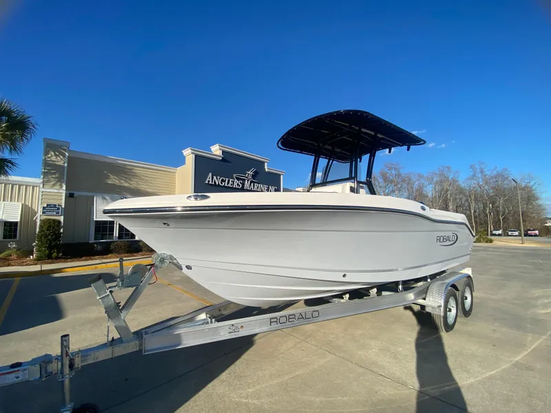 Slide: The Image of 2024 Robalo R200 Center Console boat on trailer at Angler's Marine. - 1