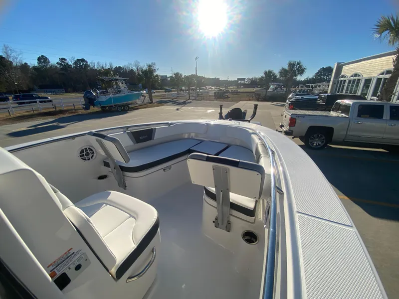 Slide: The Image of 2024 Robalo R200 Center Console boat interior with seating and storage. - 12