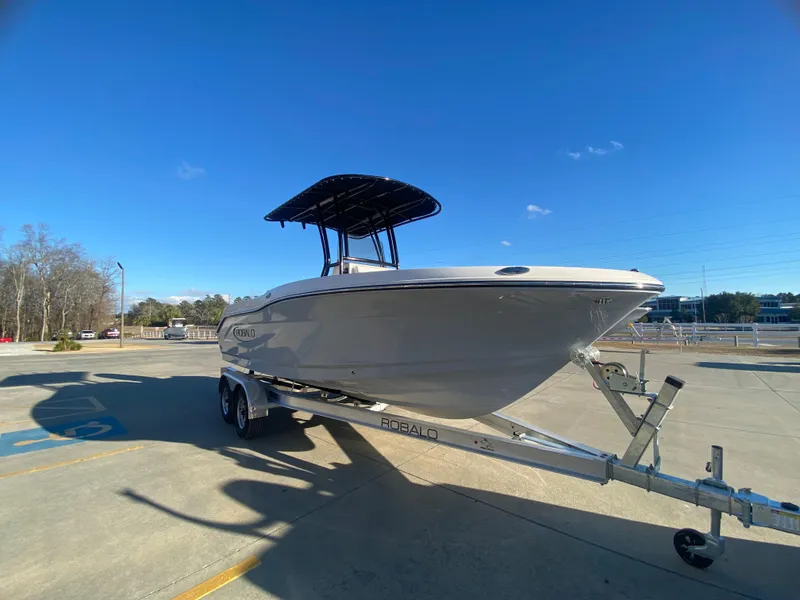 Slide: The Image of 2024 Robalo R200 Center Console boat on trailer in parking lot. - 3