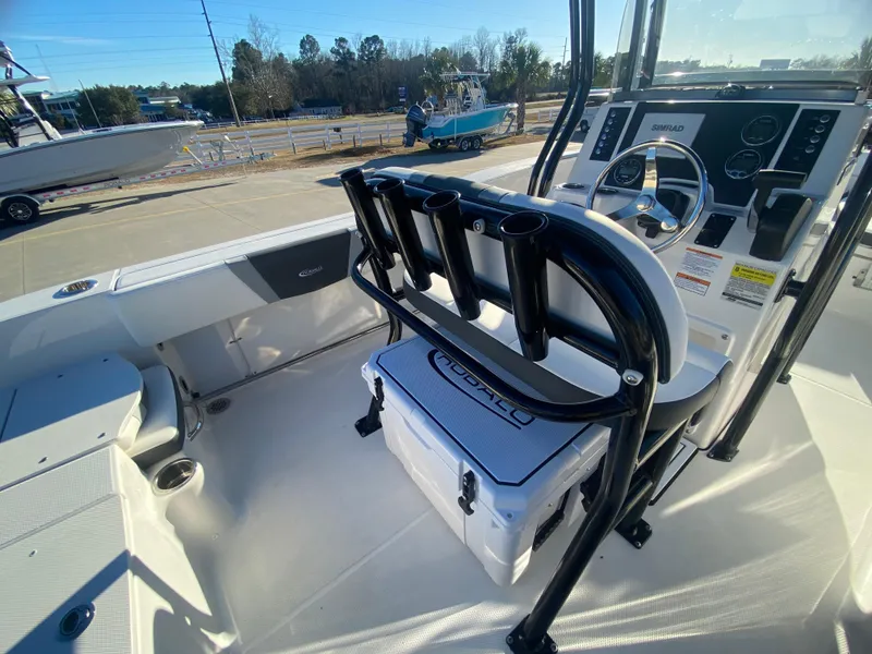 Slide: The Image of 2024 Robalo R200 Center Console boat interior with helm and seating. - 9