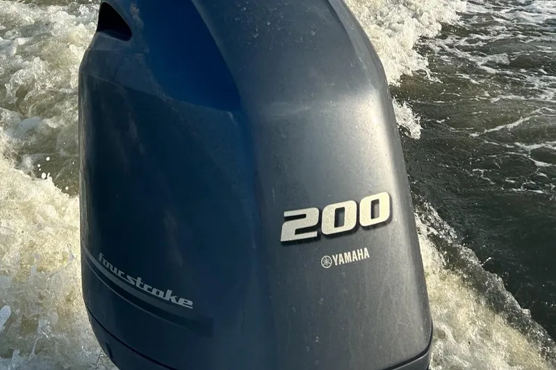 Slide: The Image of Yamaha 200 HP outboard motor on a Sea Hunt Ultra 229 boat. - 4