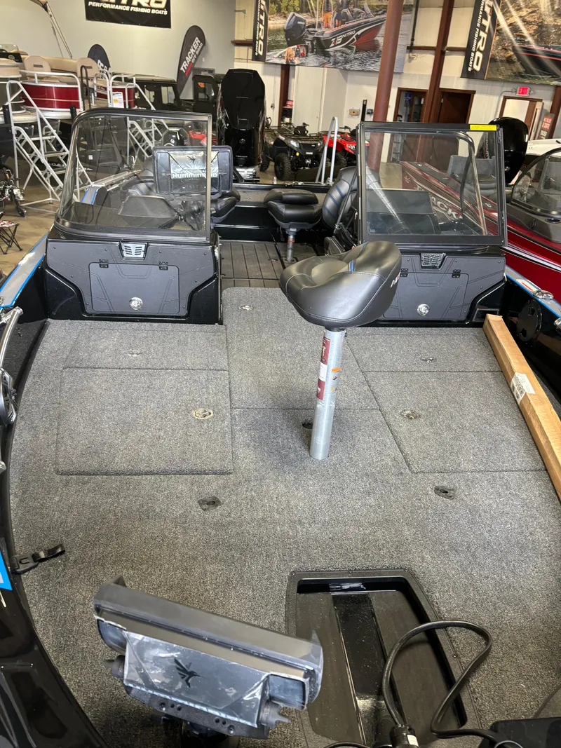 Slide: The Image of 2024 Nitro ZV21 fishing boat interior with seating and storage compartments. - 3