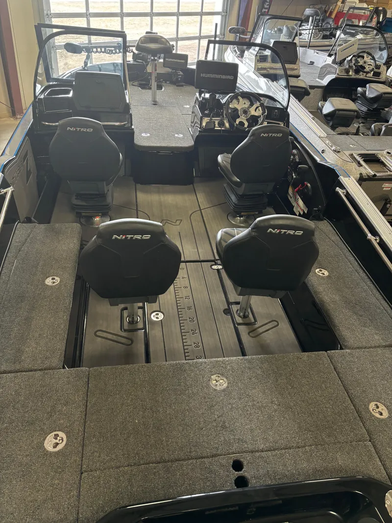 Slide: The Image of 2024 Nitro ZV21 fishing boat interior with four seats and ample storage. - 5
