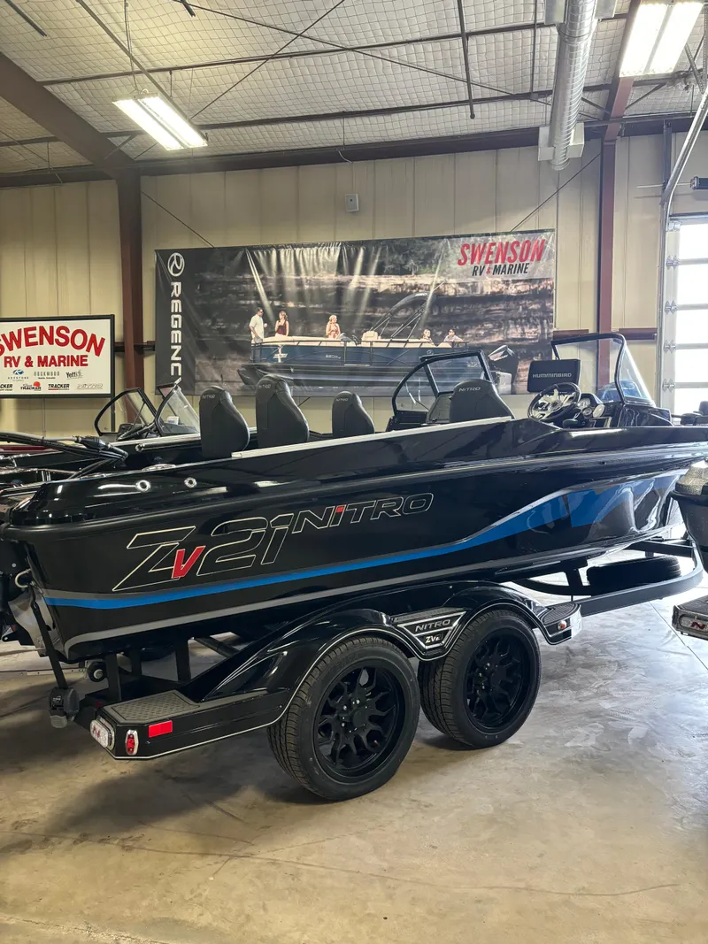 Slide: The Image of 2024 Nitro ZV21 boat on display in showroom. - 6